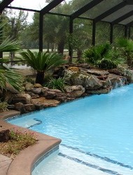 Pool Enclosure With Rock Landscaping
